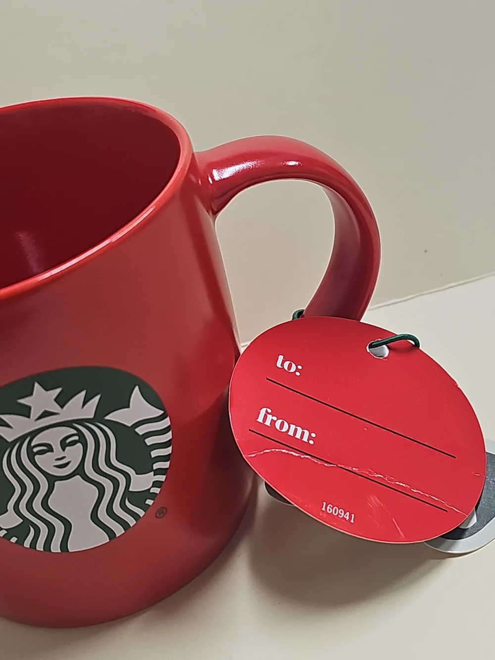 New STARBUCKS 2025 Christmas HOLIDAY Red MUG with gift tag